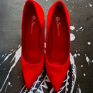 Red pumps bottom scuffed but in great condition. No visible marks otherwise